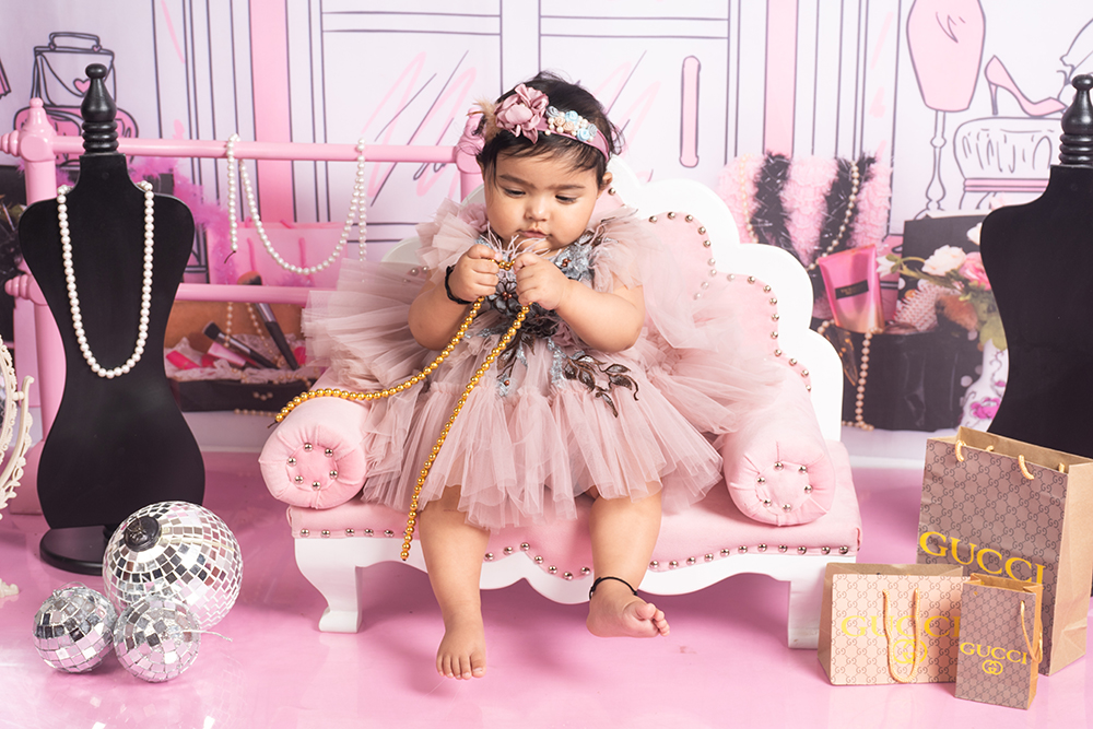 Wide baby shoot portrait with themed props