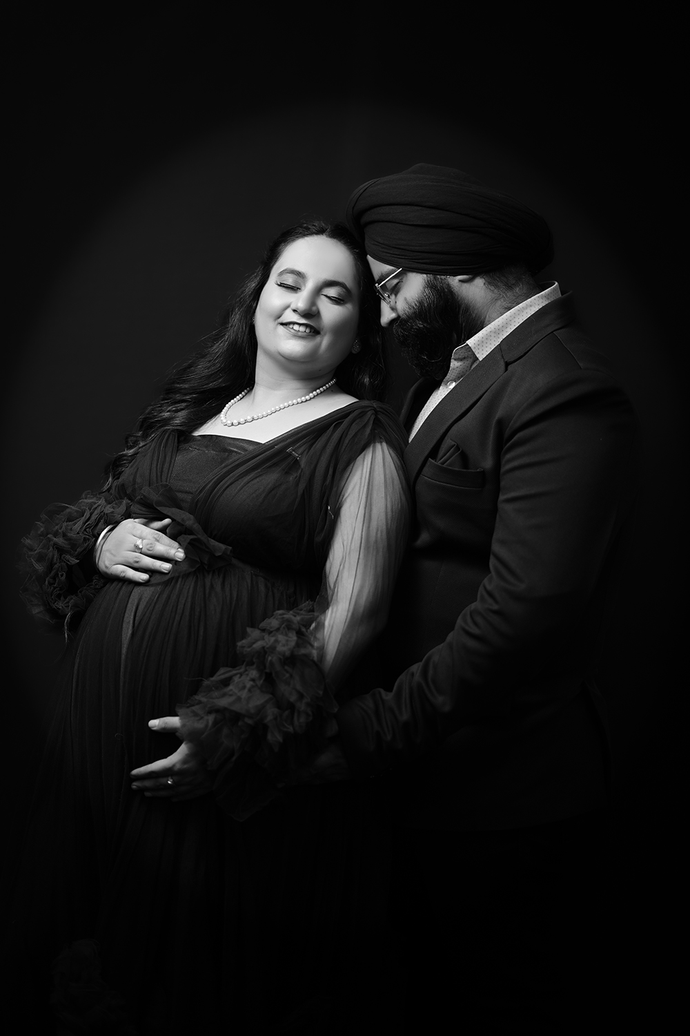 Black and white expecting couple portrait